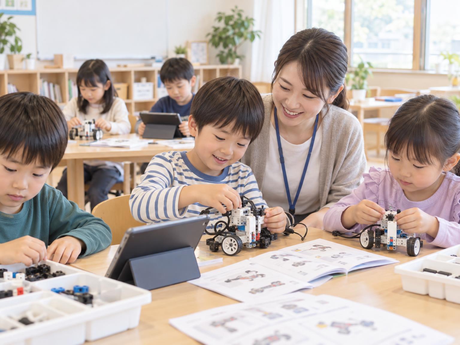 学童施設でロボット・プログラミングに取り組む子どもたちと講師