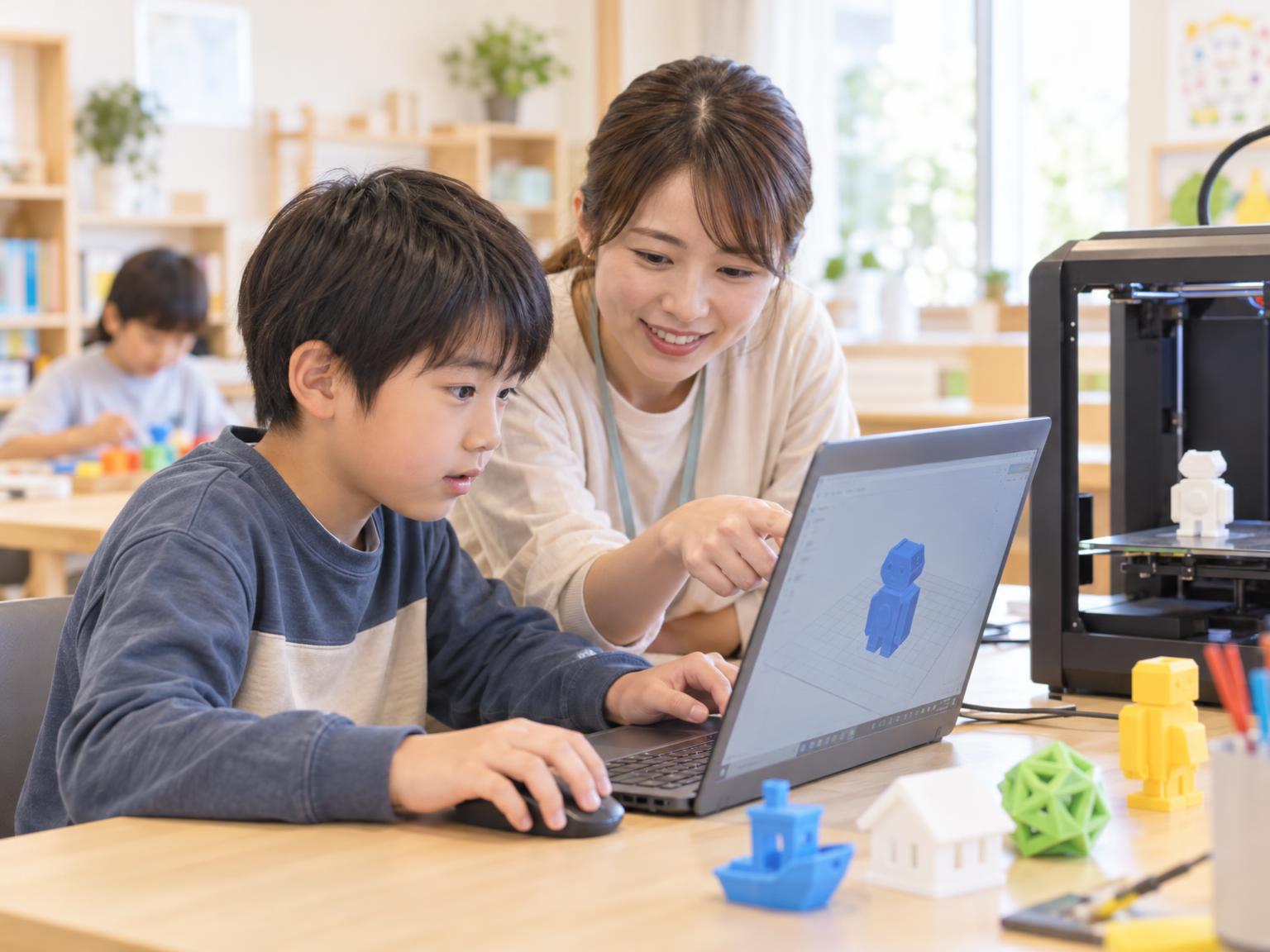 放課後等デイサービスで3Dプリンターを使ってものづくりをする小学生