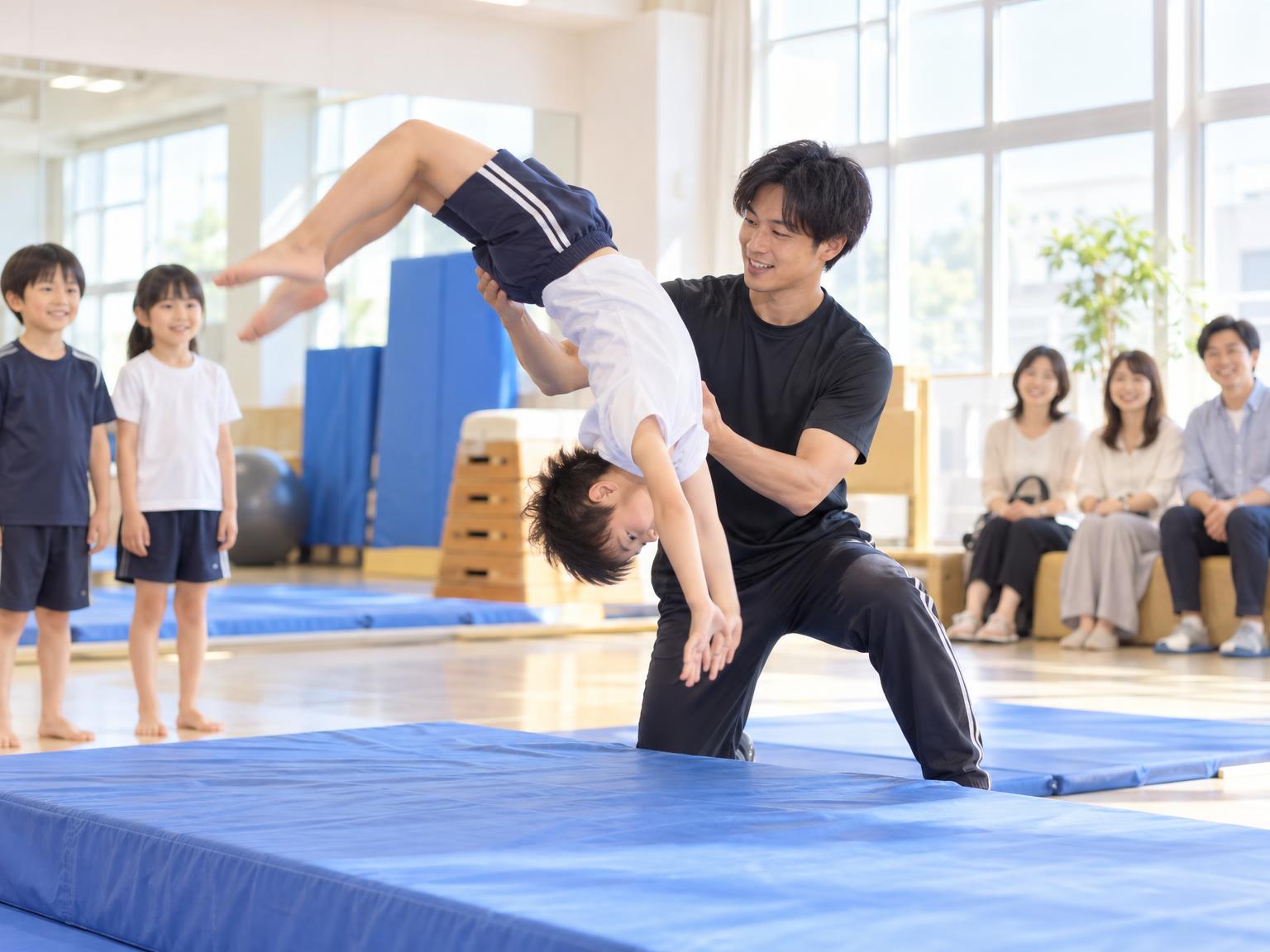 子どもがバク転の練習をしている様子